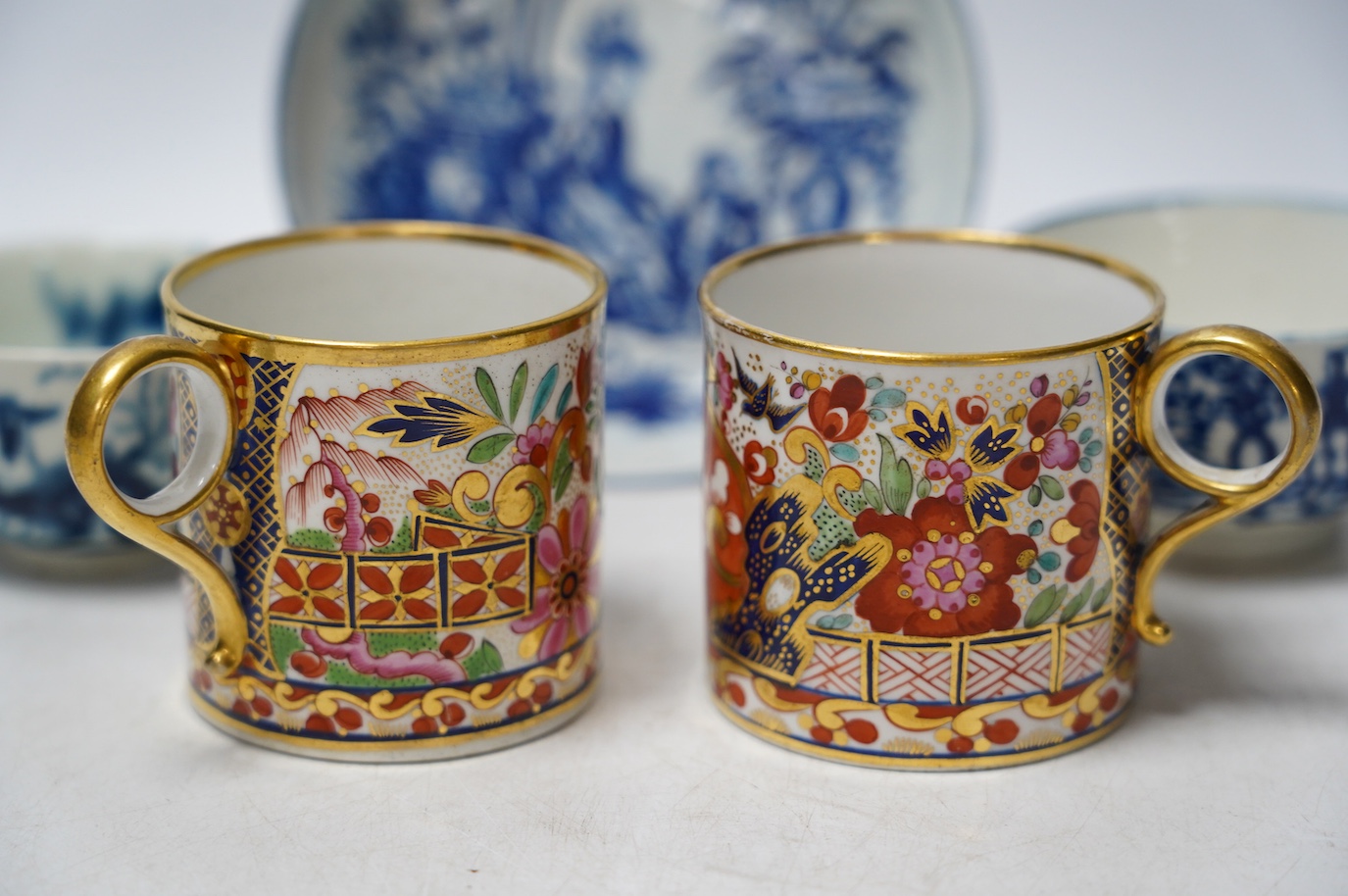 A pair of Barr Flight & Barr coffee cans and a group of Worcester to include a blue and white tea bowl and saucer and another teabowl. Condition - good